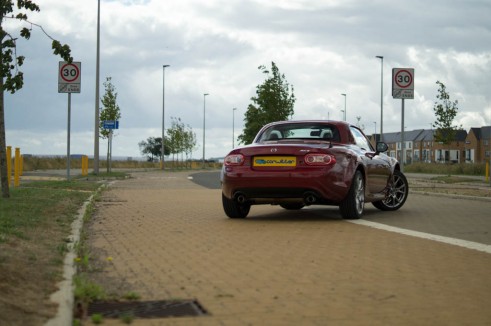 Mazda MX-5 Roadster Coupe Review - Rear Angle Roof Up - Carwitter