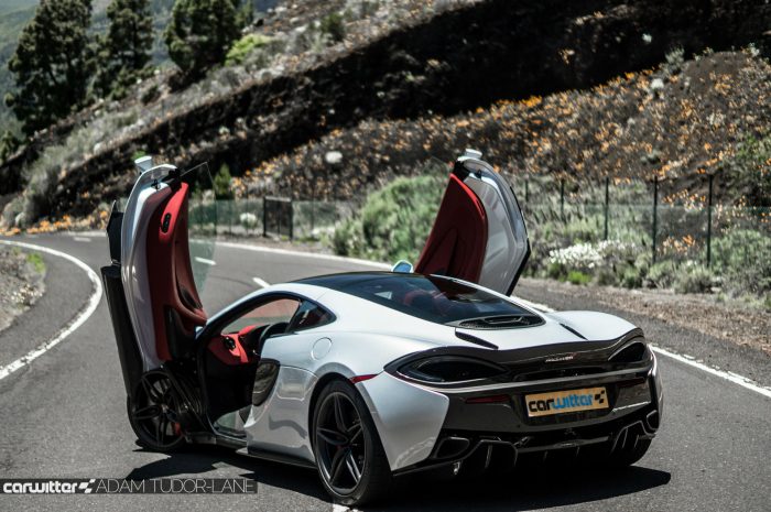 McLaren 570GT Review - Doors Up Rear Angle - carwitter